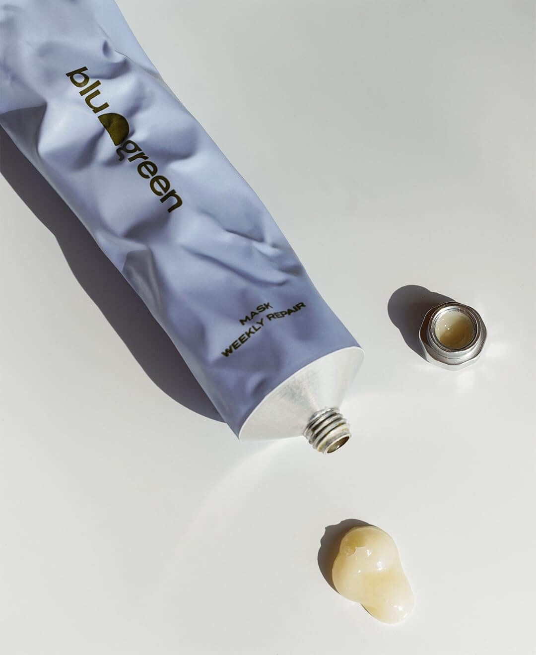 tube with product coming out of it on a table