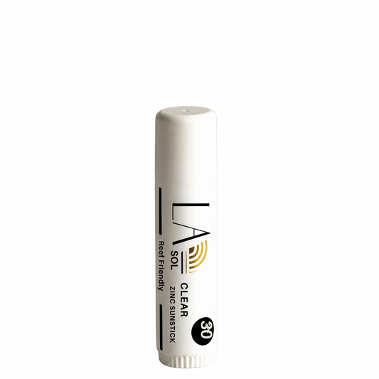Clear bottle of skincare product with a light blue gradient on a white background