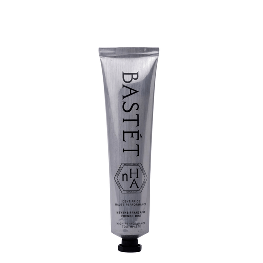 A silver squeeze tube of Bastet No. 14 Winter Framed Ice French Mint toothpaste with a black cap, centered on a plain white background.