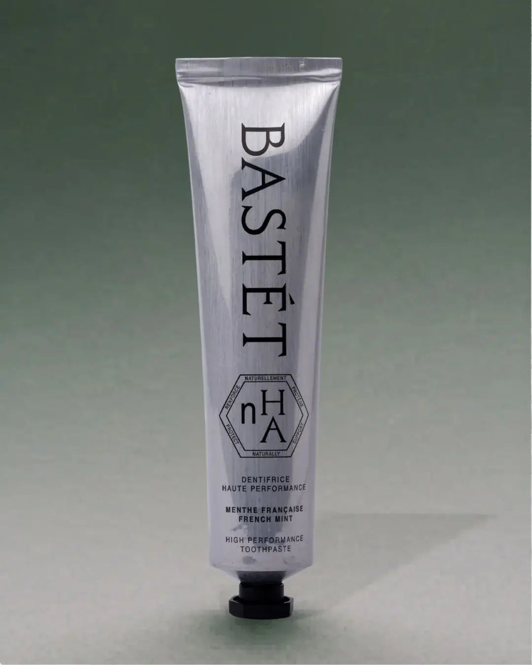 Bastét toothpaste tube on a gray background