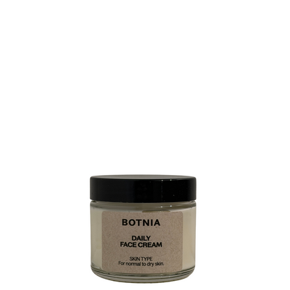 A jar of Botnia Daily Face Cream with a black lid and a beige label, set against a plain white background.