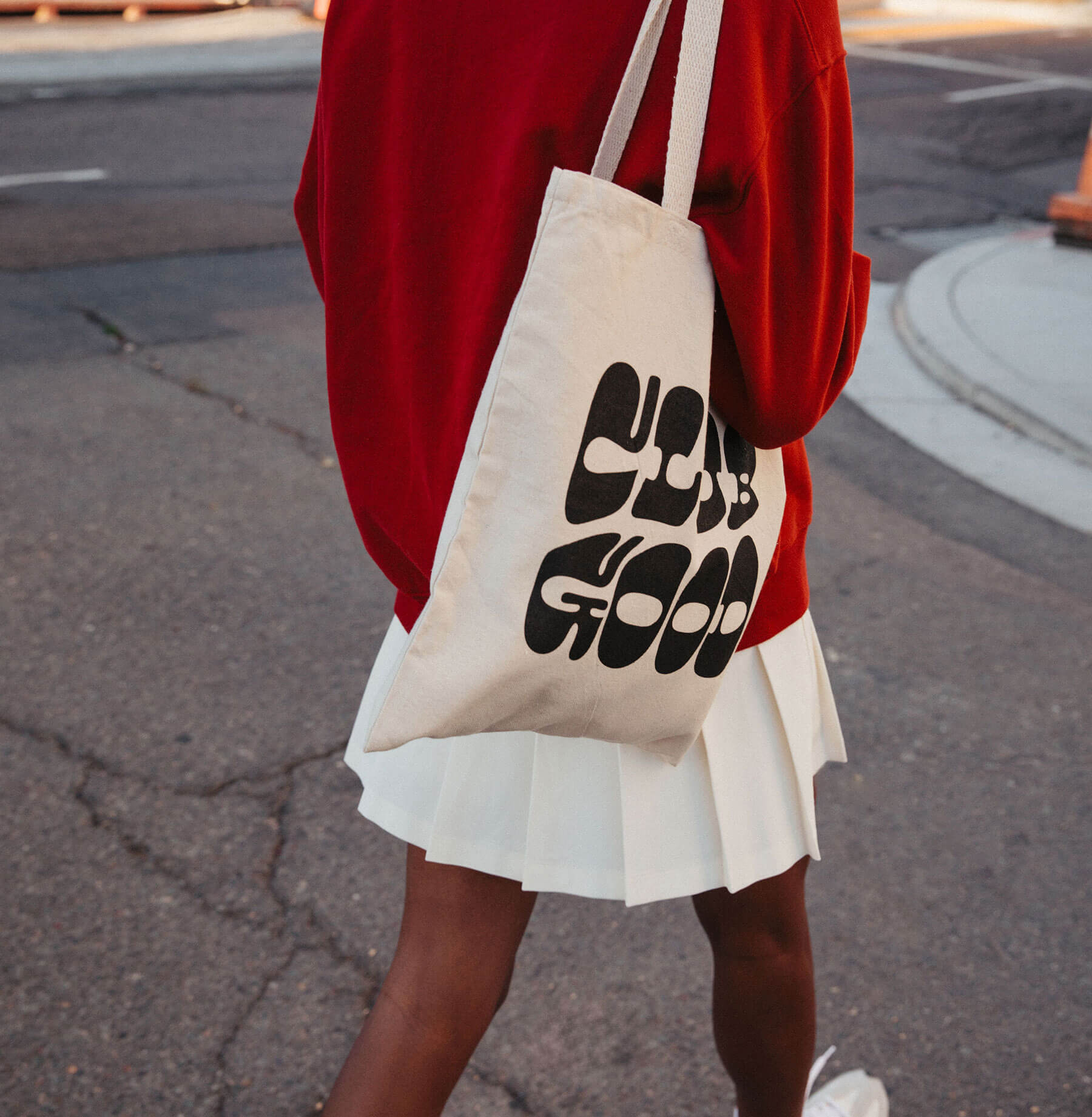 Woman holding club good bag