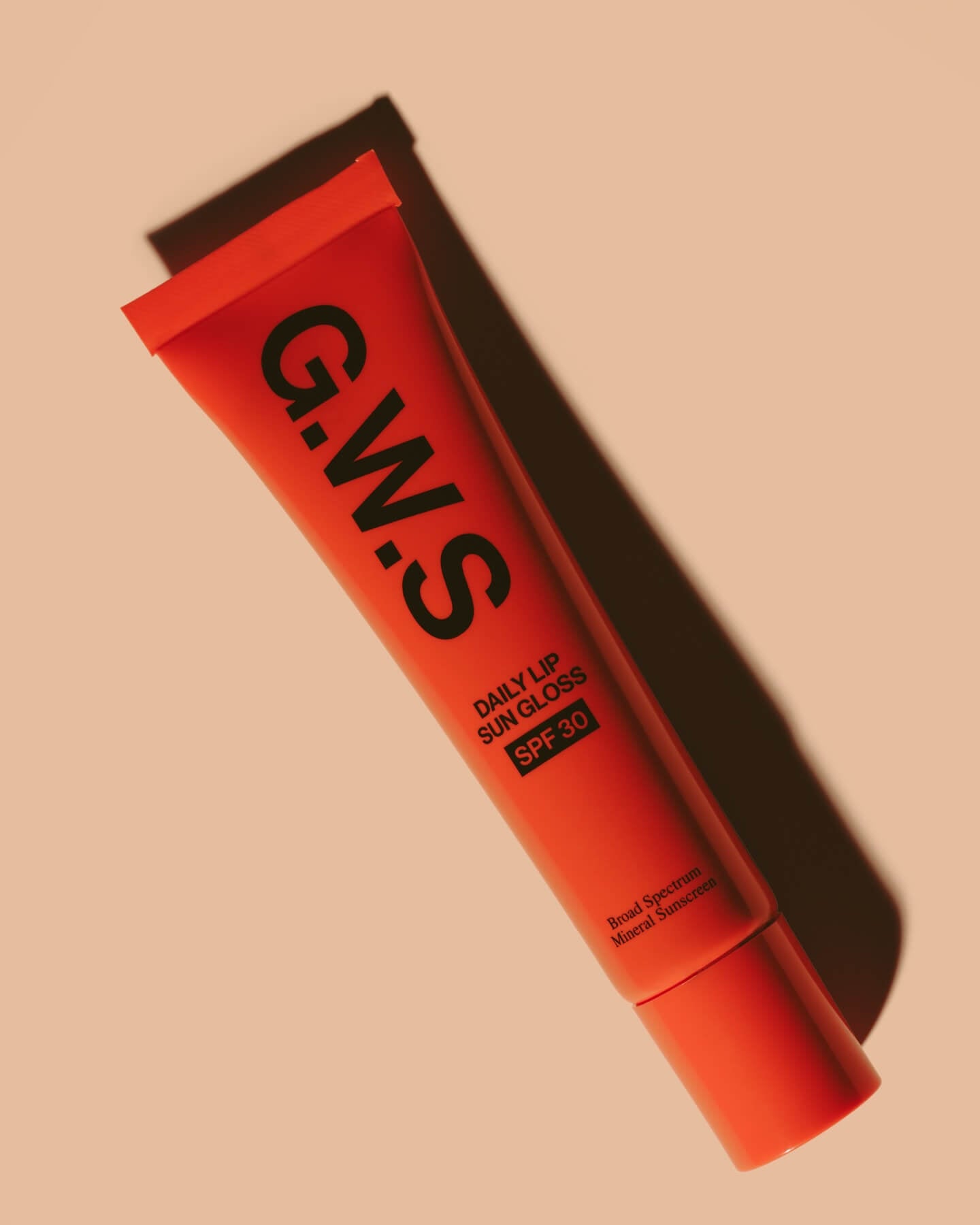 An orange squeeze tube of G.W.