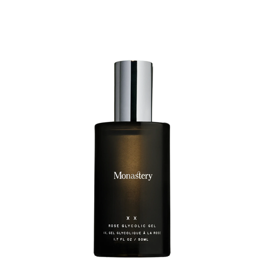 Monastery XX Rose Glycolic Gel in a dark amber glass bottle with a reflective silver cap, shown on a plain white background.