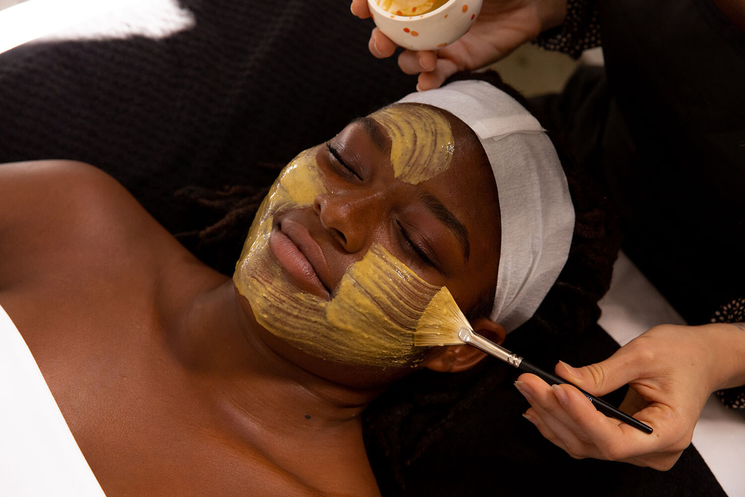 woman getting pumpkin peel at shop good