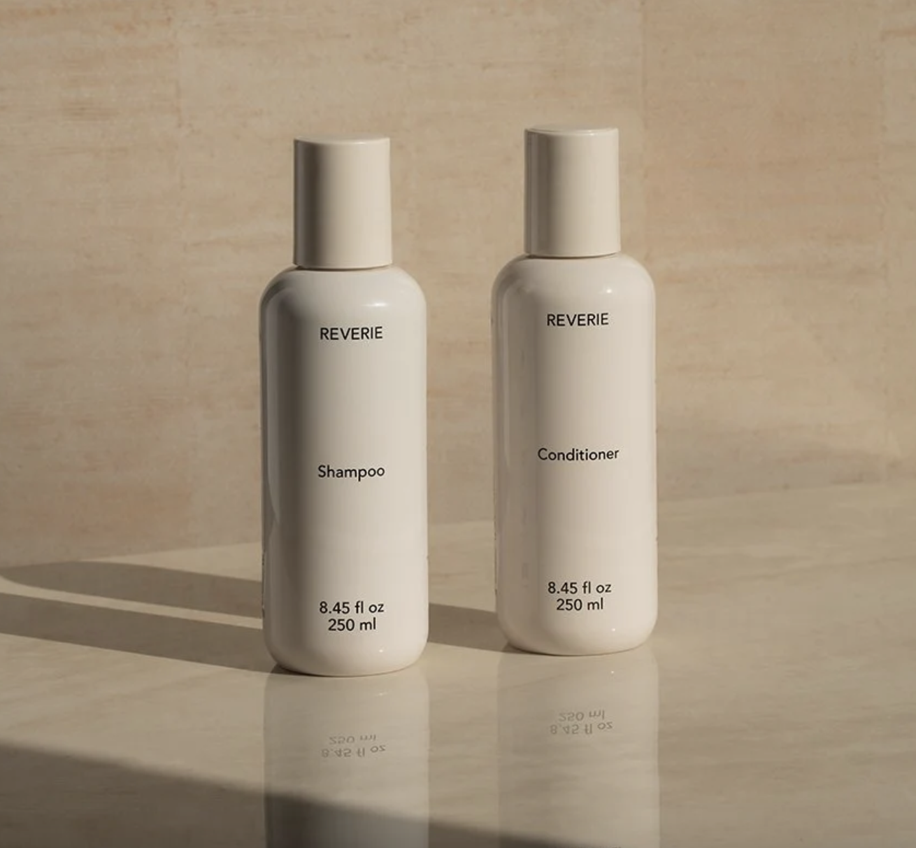reverie shampoo and conditioner on table