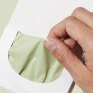 model pulling paper from envelope